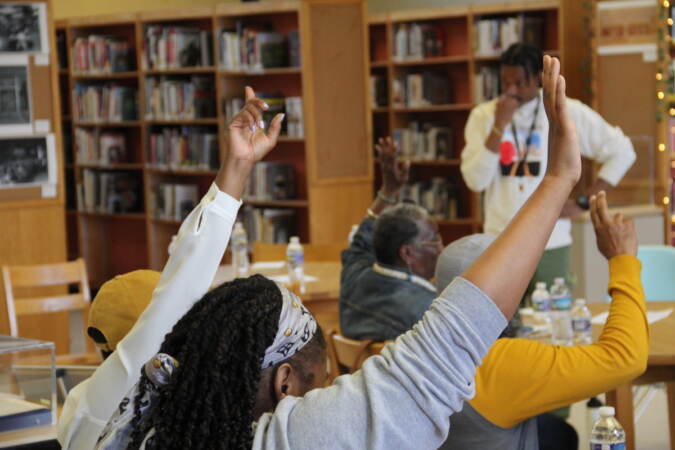 People raise their hands in the hair.