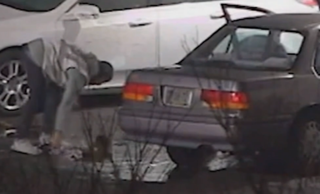 catalytic-converter-theft-6abc-2023-06-28 Surveillance photo of someone breaking into a car.