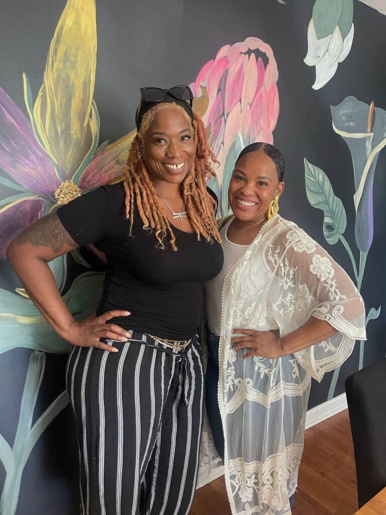 Coretta Wright and Denise Fraizer posing together.