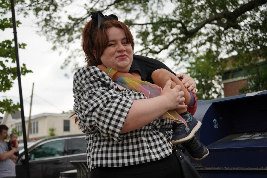 Danielle Kulp holds her son while posing for a photo.