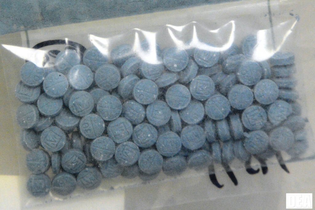 Heroin Fentanyl a bag of blue pills