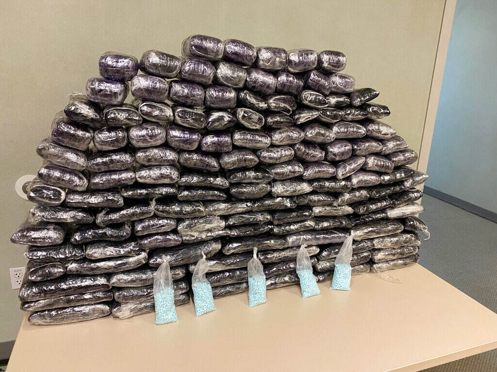 Opioid Crisis A number of fake fentanyl pills seized by DEA are displayed in a pile.