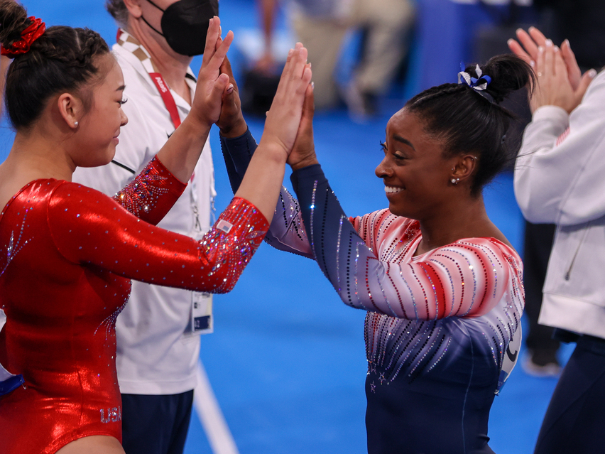 Sunisa Lee and Simone Biles of Team USA during the Women’s Balance Beam Final at the Tokyo 2020 Olympic Games in August 2021. Sunisa Lee and Simone Biles of Team USA during the Women's Balance Beam Final at the Tokyo 2020 Olympic Games in Aug. 2021