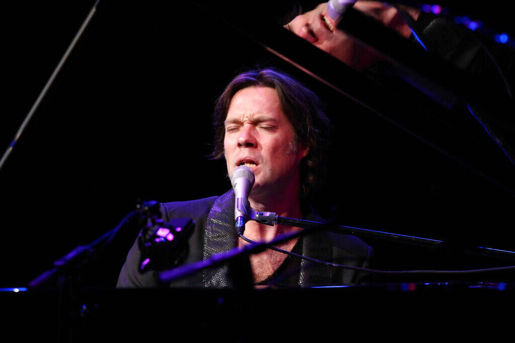 Rufus Wainwright Rufus Wainwright sings while playing the piano.