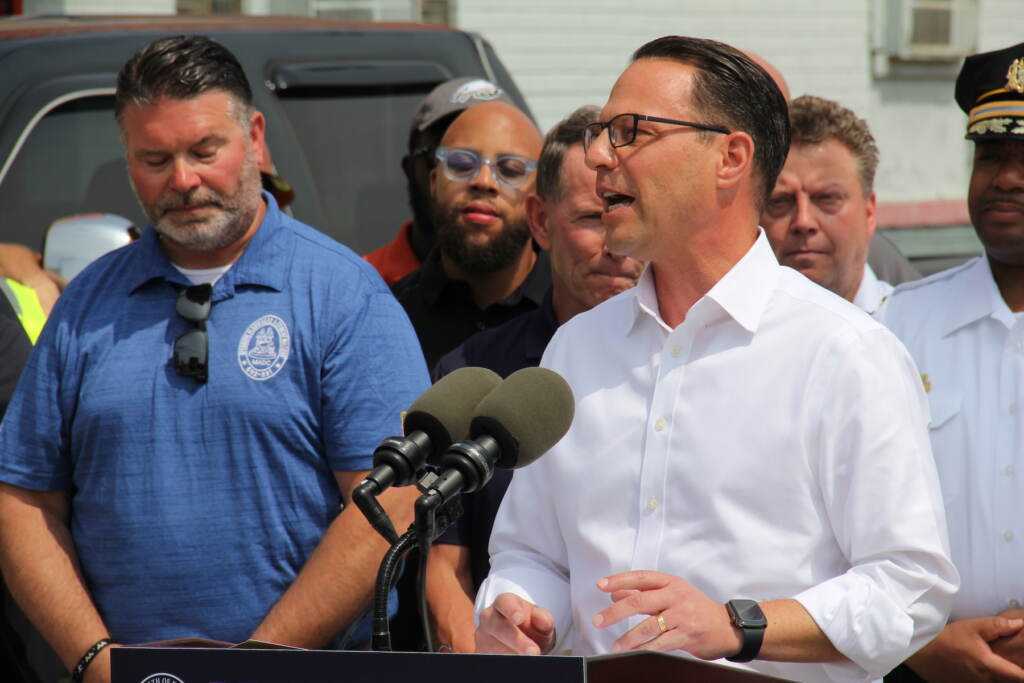 Josh Shapiro speaking at a microphone.