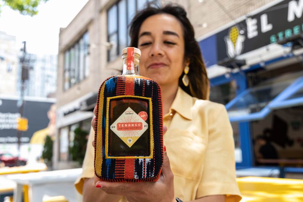 sofiadeleon-tenagorum-05-scaled Sofia Deleon poses with a bottle of her new Guatemalan rum.