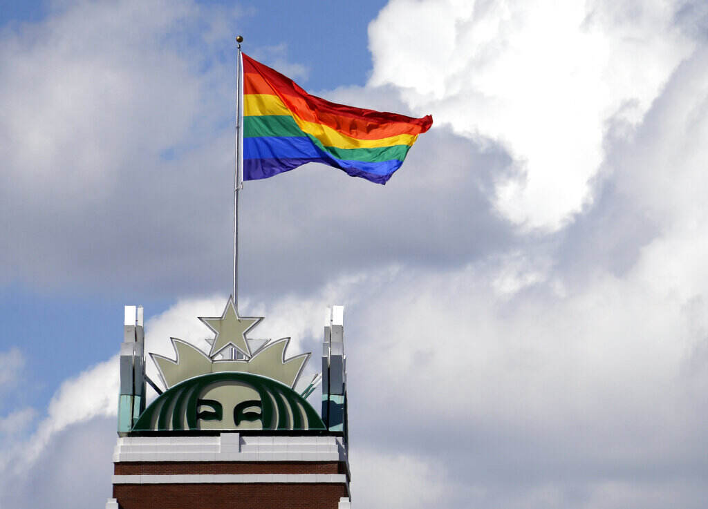Seattle Gay Pride A Pride Flag flies on top of the Starbucks logo on top of the company's headquarters in Seattle.
