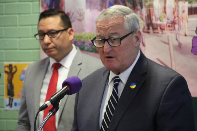 Mayor Jim Kenney speaks into a microphone