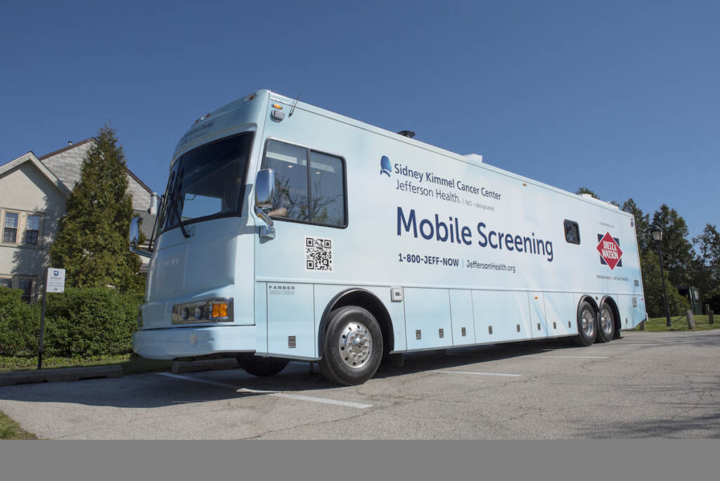 The SKCC and Dietz Watson Mobile Cancer Screening mobile van parked outside on a sunny day.