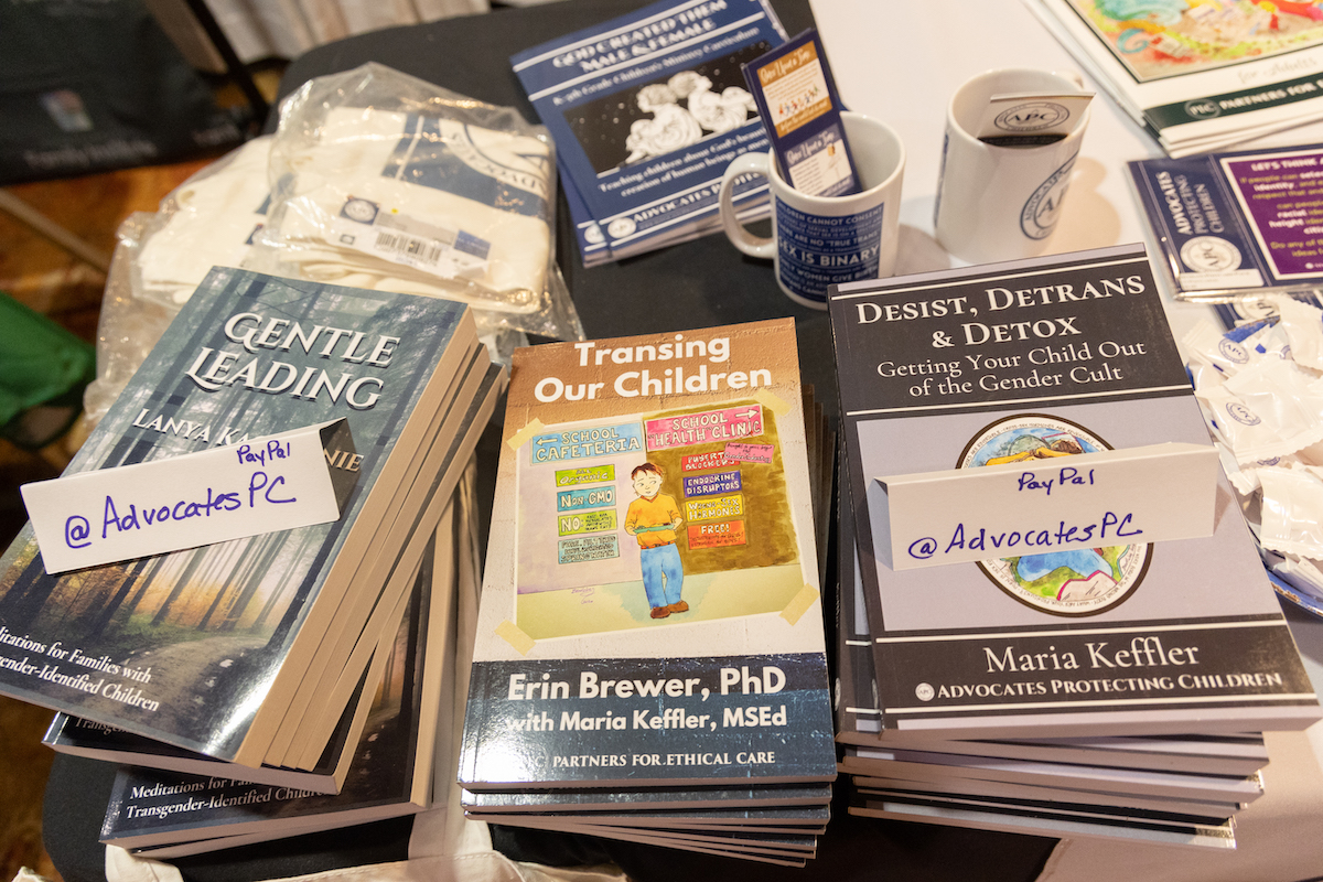 Books for sale on a table with titles including, 