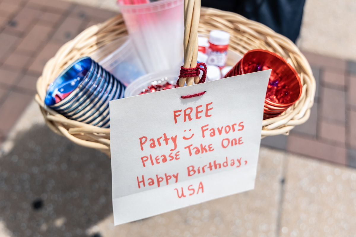 A basket of things has a sign that reads 