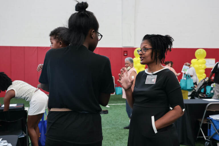 Dr. Sharee Livingston Obstetrician-Gynecologist at UPMC chats with moms at the community baby shower