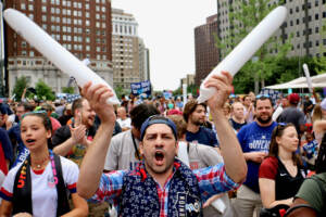 Soccer fans celebrate in Love Park