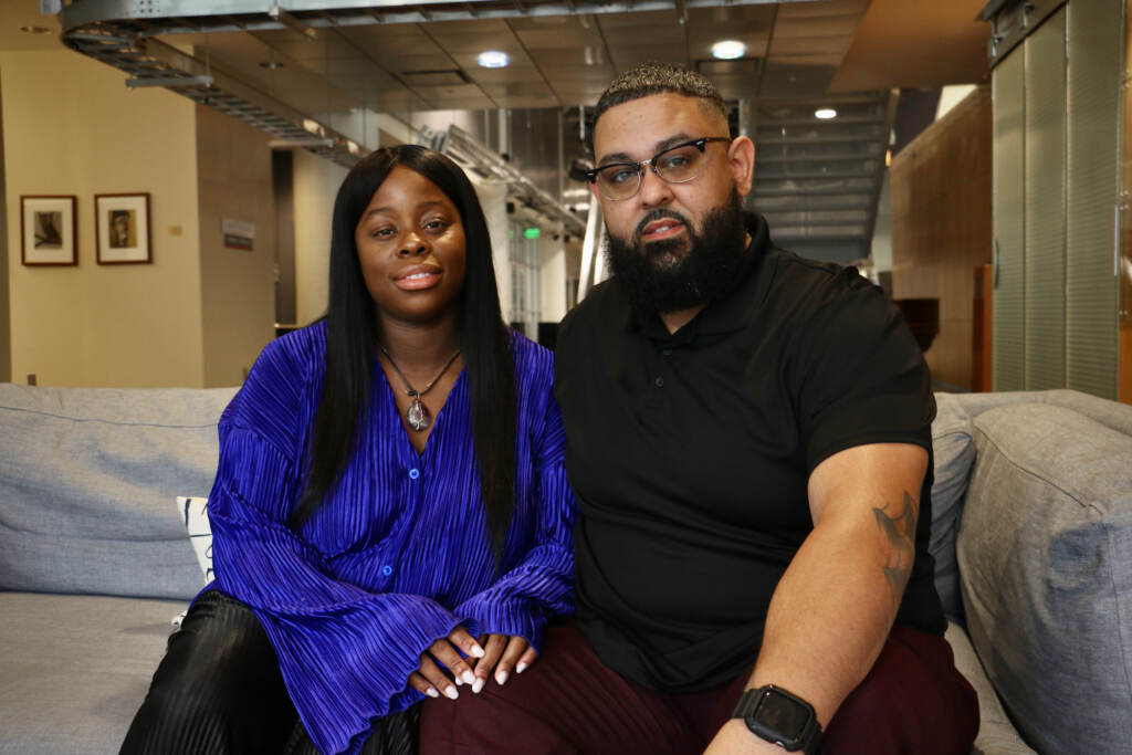 Rasheida and Raymond Colon pose for a photo, holding hands