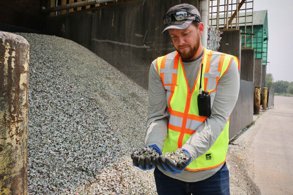 2023 06 29-e lee-ryan gregor-westampton nj burlington county recycling-crushed glass for glass foam handfuls Plant manager Ryan Gregor holds handfuls of crushed glass