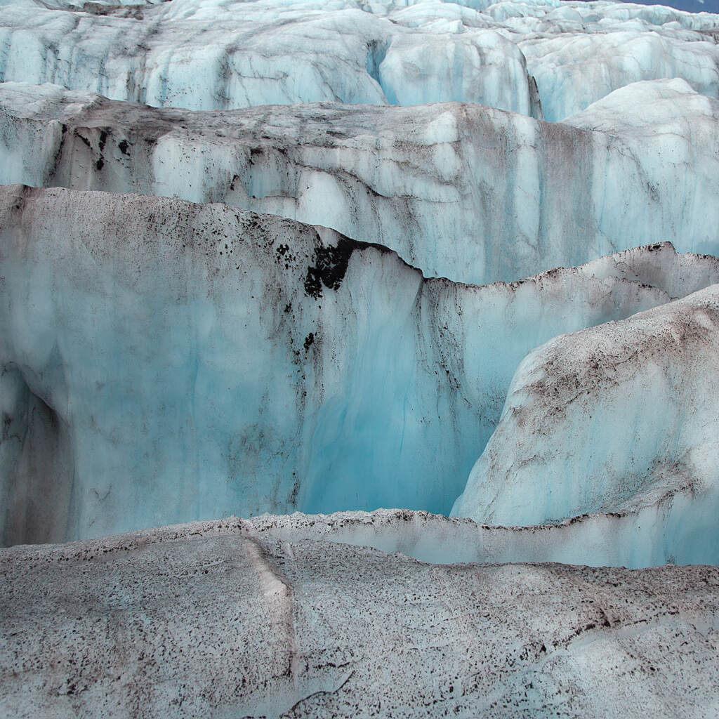 A photograph shows a glacier.
