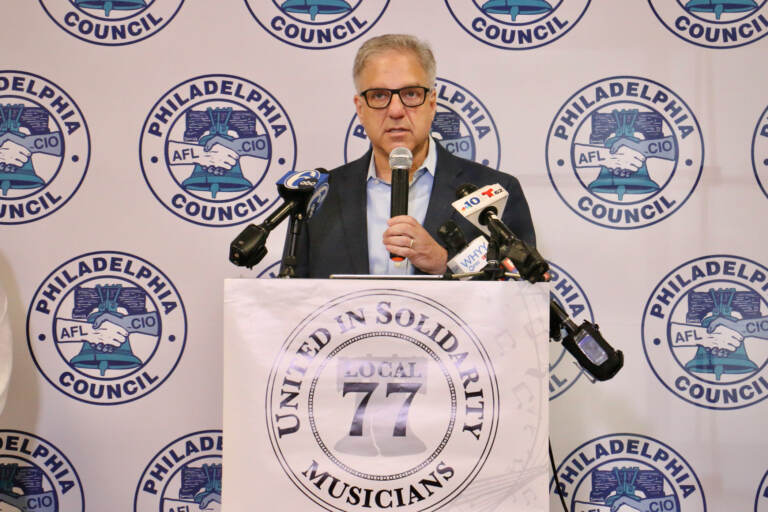 Jonathan Fink speaks at a podium.