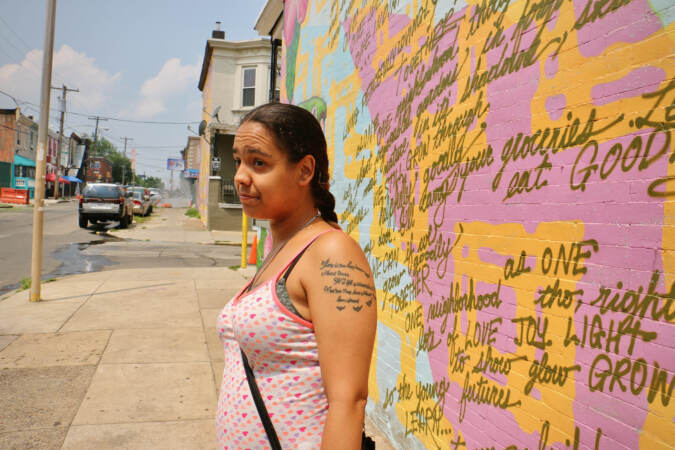 Standing on Indiana Avenue near Water Street, Nancy Serrano says she and her children rarely walk around their neighborhood because of the open drug use there. (Emma Lee/WHYY)