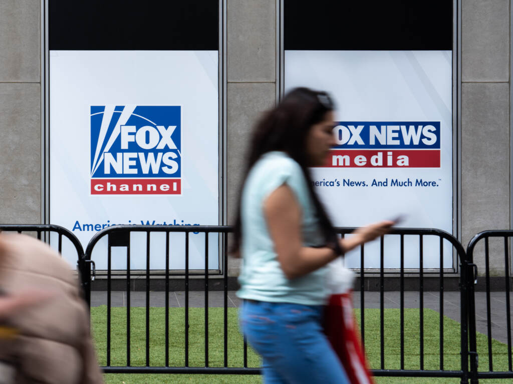 A man who was at the Jan. 6 attack on the U.S. Capitol has sued Fox News for defamation. Here, a woman walks by the Fox News headquarters in New York in April. A man who was at the Jan. 6 attack on the U.S. Capitol has sued Fox News for defamation. Here, a woman walks by the Fox News headquarters in New York in April.