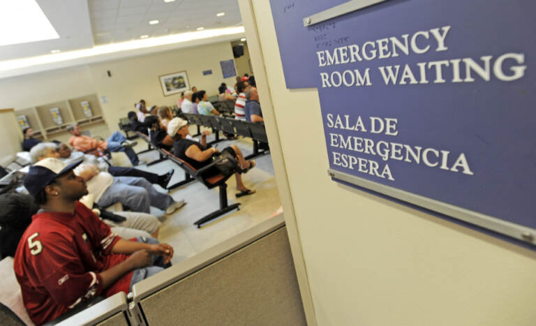FILE - In this July 30, 2009 photo, patients wait in the emergency room at Cook County Hospital in Chicago. Senate Democrats passed a landmark health care bill Thursday, Dec. 24, 2009,  that could define President Barack Obama's legacy and usher in near-universal medical coverage for the first time in U.S. history. (AP Photo/Paul Beaty, file)
