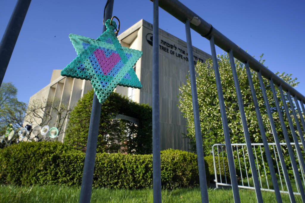 Pittsburgh Synagogue Shooting File photo: A Star of David hangs from a fence outside the dormant landmark Tree of Life synagogue in Pittsburgh's Squirrel Hill neighborhood, April 19, 2023.