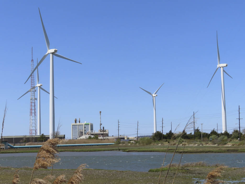 Offshore Wind-Tax Credit Land-based windmills turn in the wind in Atlantic City, N.J., on April 28, 2022.