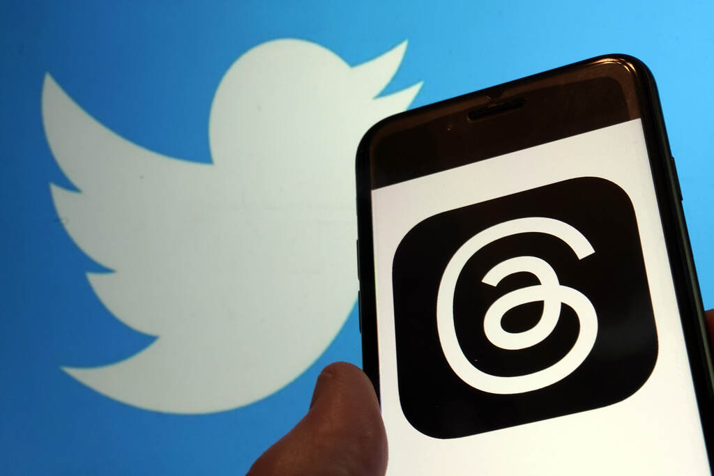 Twitter Meta Threads FILE - This photo, taken in New York on July 5, 2023, show the logo for Meta's new app Threads, right, and that of Twitter. In a cease-and-desist letter earlier this week, Twitter threatened legal action against Instagram parent company Meta over the new text-based app, Threads. (AP Photo/Richard Drew, File)