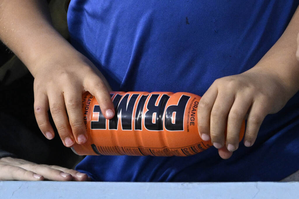 Energy Drink-Investigation-Schumer A child holds a PRIME hydration drink prior to a baseball game between the Los Angeles Dodgers and the Arizona Diamondbacks, March 31, 2023, in Los Angeles