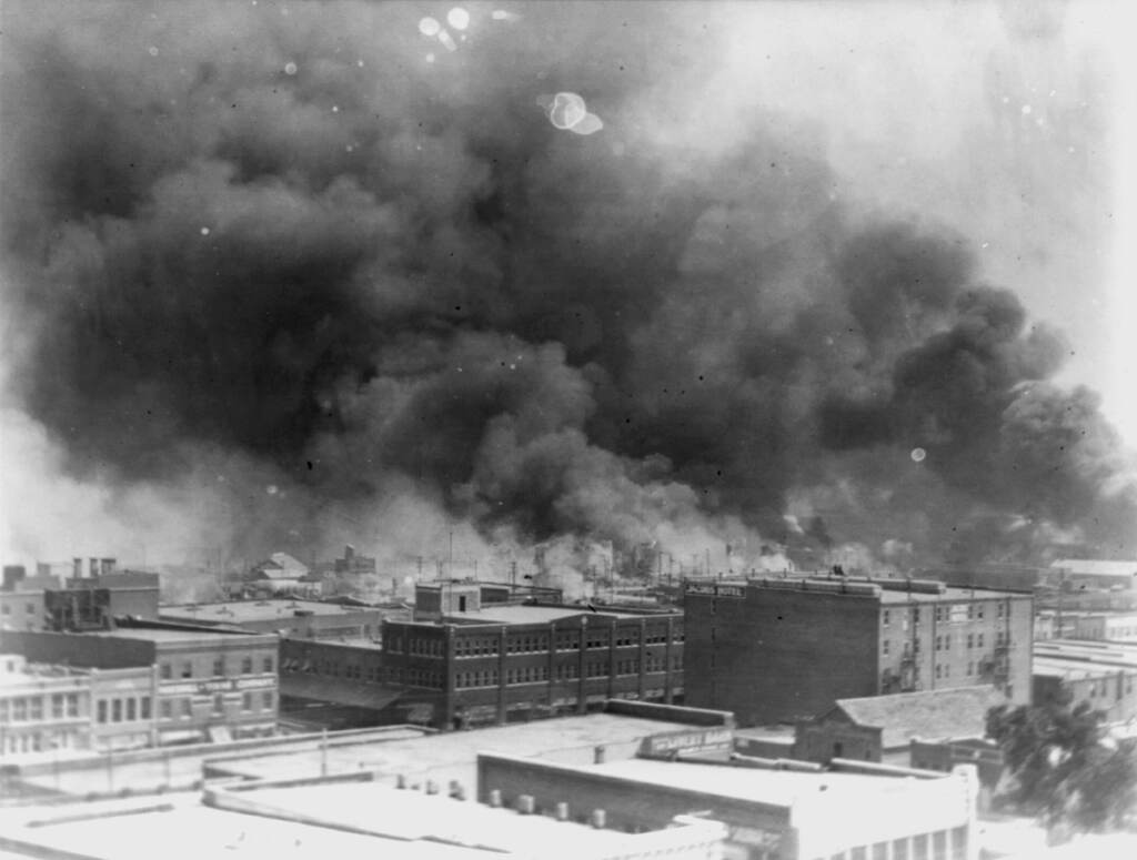 Racial Injustice-Tulsa Massacre-Lawsuit In this 1921 image provided by the Library of Congress, smoke billows over Tulsa, Okla. An Oklahoma judge has thrown out a lawsuit seeking reparations for the 1921 Tulsa Race Massacre, dashing an effort to obtain some measure of legal justice by survivors of the deadly racist rampage. (Alvin C. Krupnick Co./Library of Congress via AP)