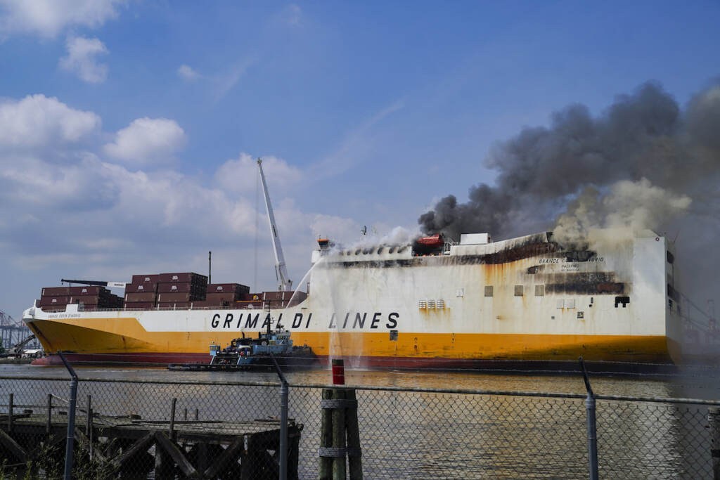 Cargo Ship Fatal Fire FILE - Emergency personnel battle against a fire aboard the Italian-flagged Grande Costa d'Avorio cargo ship at the Port of Newark, Friday, July 7, 2023, in Newark, N.J. Crews extinguished the intensely burning fire aboard a cargo ship docked in New Jersey after nearly a week and are now beginning their investigation into the blaze that resulted in the deaths of two firefighters, officials said Tuesday, July 11, 2023. (AP Photo/John Minchillo, File)