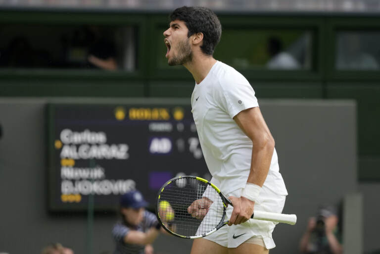 Spain's Carlos Alcaraz celebrates after winning a point against Serbia's Novak Djokovic in the final of the men's singles on day fourteen of the Wimbledon tennis championships in London