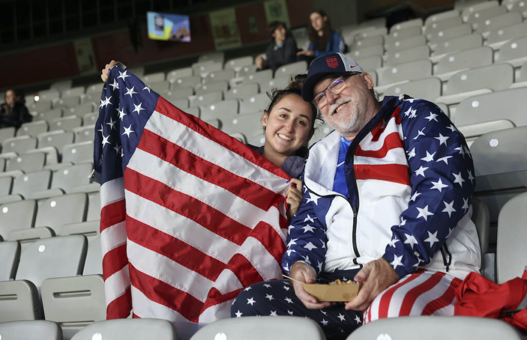 Soccer WWCup American Fans David Tritz, from Laguna Hills, California, and his daughter Erin Tritz, pose for a photo after taking their seats at the Women's World Cup soccer match between New Zealand and Norway in Auckland, New Zealand, Thursday, July 20, 2023. An estimated 20,000 Americans are coming to New Zealand for the Women's World Cup, and many have arrived in the days before the U.S. women's team plays its opener against Vietnam on Saturday