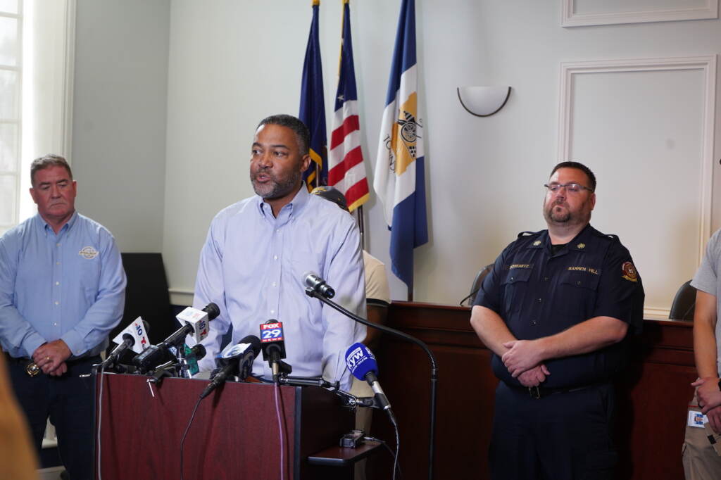 Ken Lawrence speaking at a press conference