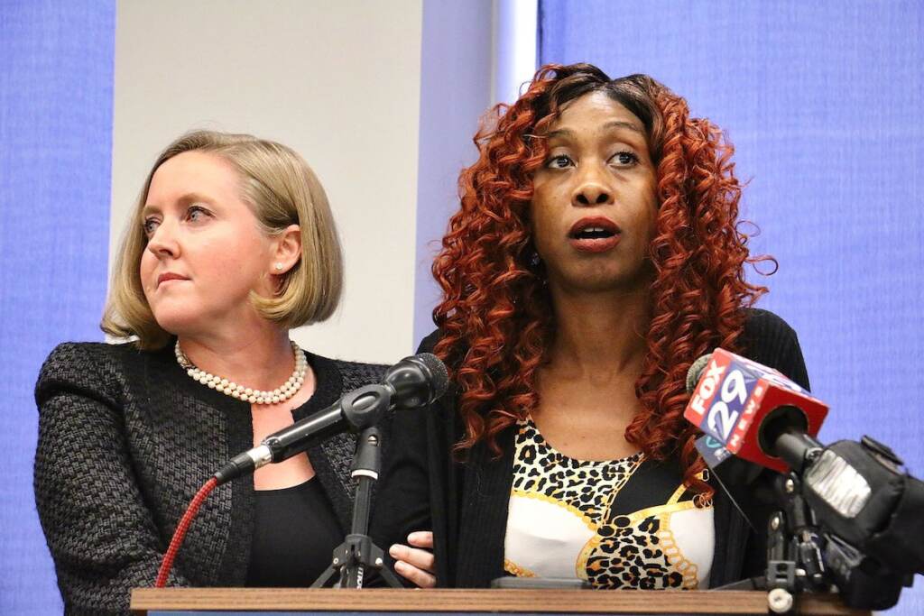 angel-davis-lawsuit-1 Angel Davis stands at a podium with her lawyer, Bethany Nikitenko