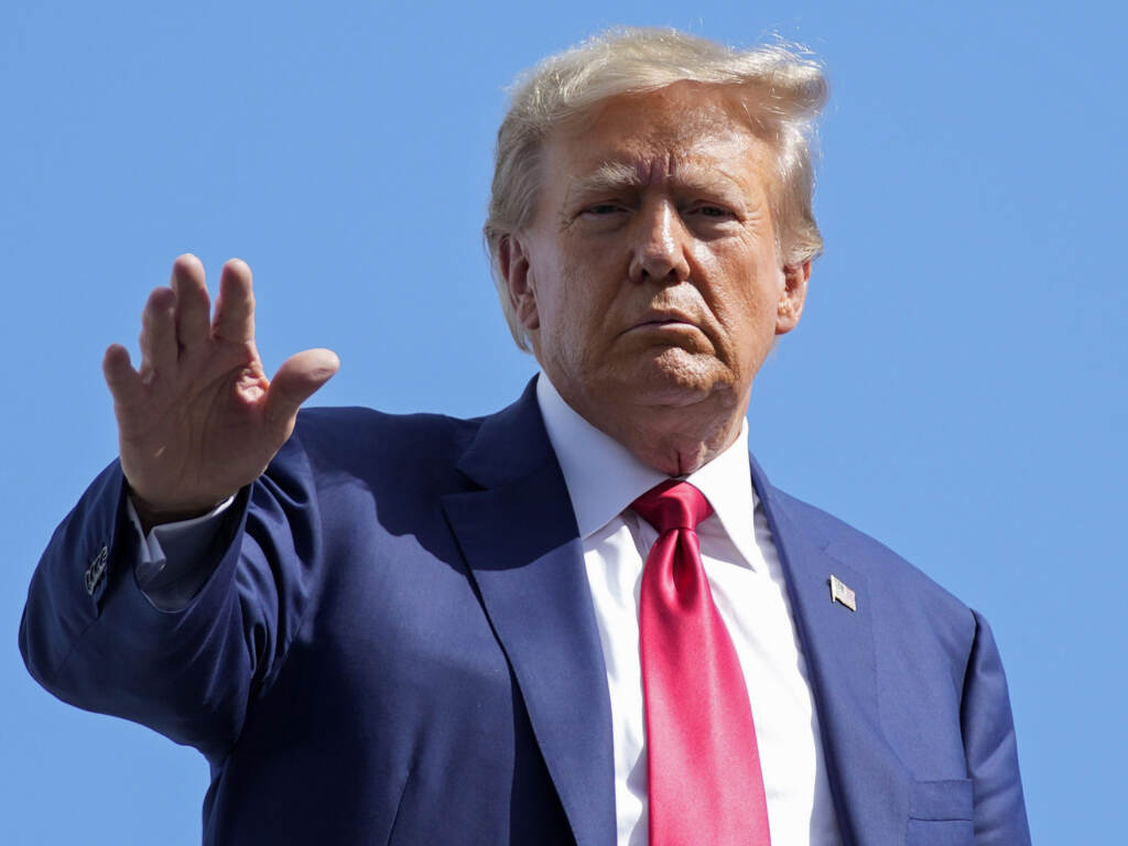 Former President Donald Trump waves before boarding his personal plane at Miami International Airport on June 13, in Miami after his first court appearance in the classified documents case. Former President Donald Trump waves before boarding his personal plane at Miami International Airport on June 13, in Miami after his first court appearance in the classified documents case.