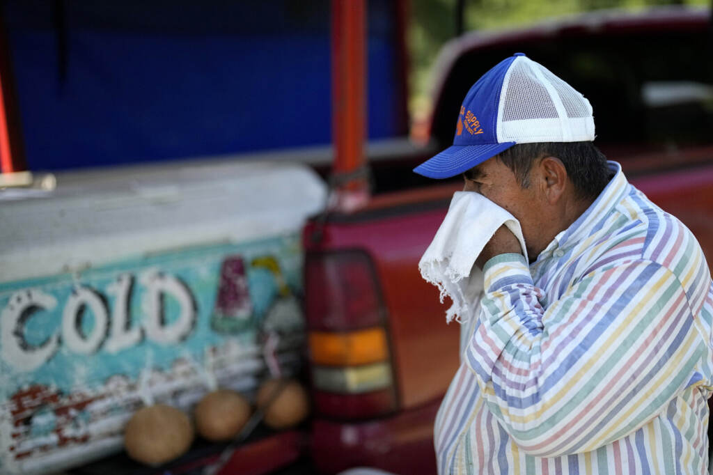 Andres Matamoros Andres Matamoros wipes the sweat from his face while selling fresh fruit and cold coconuts from his roadside stand on June 28, 2023, in Houston. Nearly 400 daily maximum temperature records fell in the South in June and the first half of July, most of them in Texas