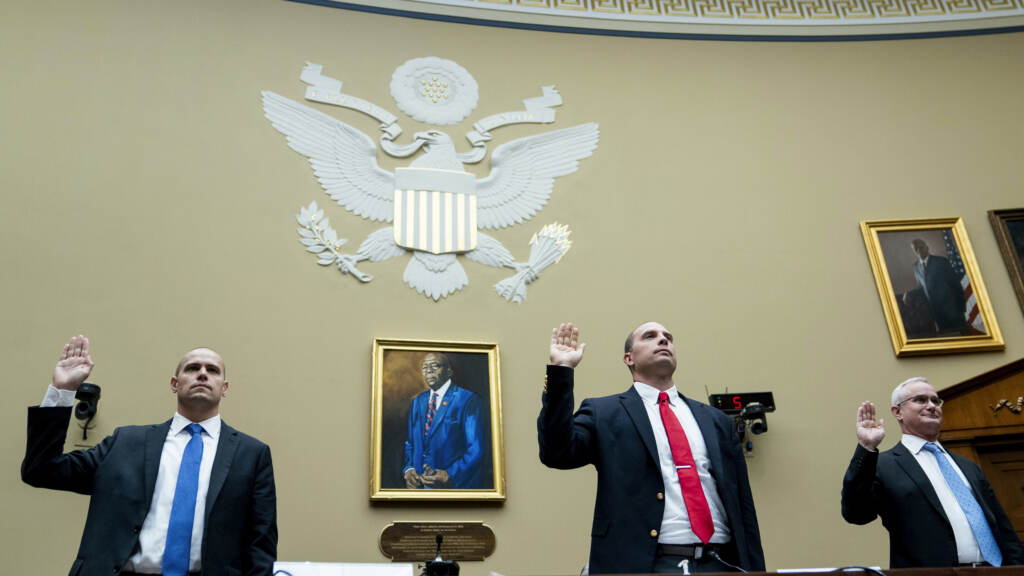 Ryan Graves, executive director of Americans for Safe Aerospace (left), retired Air Force Maj. David Grusch and retired Navy Cmdr. David Fravor are sworn in during a House Oversight and Accountability subcommittee hearing on UFOs on Wednesday. Ryan Graves, executive director of Americans for Safe Aerospace (left), retired Air Force Maj. David Grusch and retired Navy Cmdr. David Fravor are sworn in during a House Oversight and Accountability subcommittee hearing on UFOs on Wednesday.