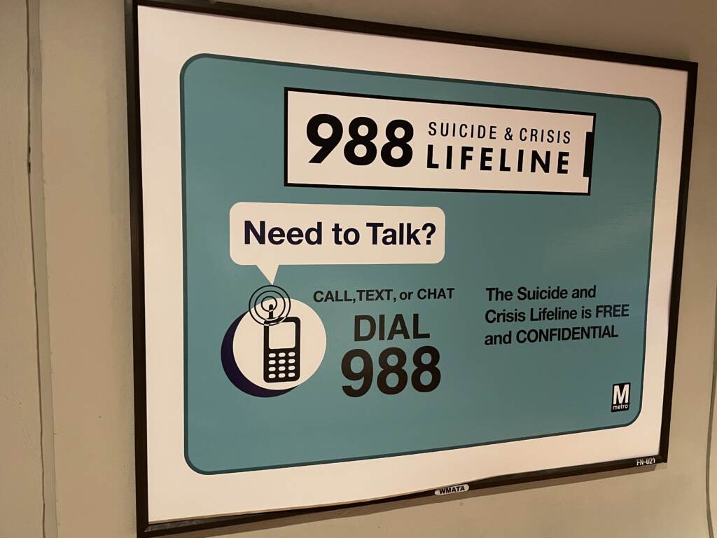 The 988 Suicide and Crisis Lifeline marks one year of operation on July 16. A sign advertises the 988 lifeline