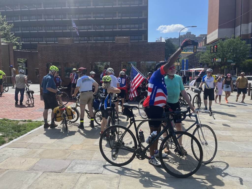Cyclists pose for a selfie.