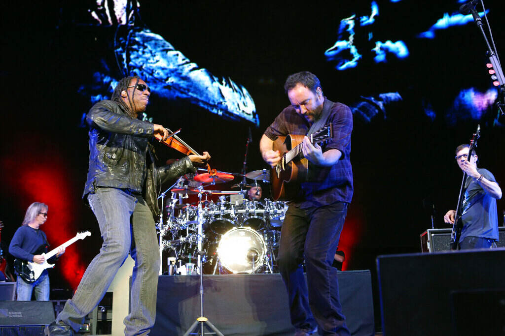 The Dave Matthews Band performs onstage.
