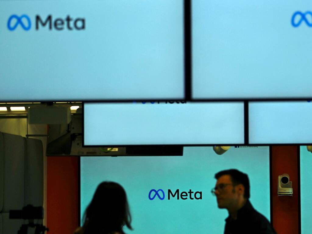 Visitors stand near screens displaying the Meta logo in Berlin on June 6. Under a U.S. judge’s new ruling, much of the federal government is now barred from working with social media companies to address removing content that might contain “protected free speech.” Visitors stand near screens displaying the Meta logo in Berlin on June 6. Under a U.S. judge's new ruling, much of the federal government is now barred from working with social media companies to address removing content that might contain