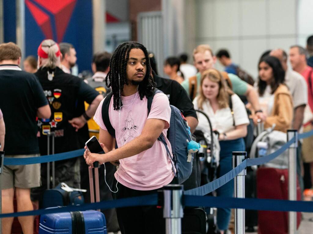 US-TRAVEL-AVIATION-HOLIDAY A traveler waits in line at the airport.