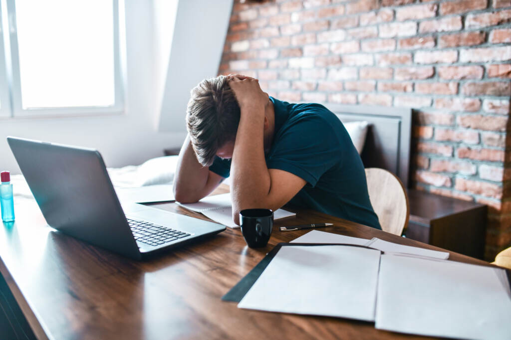 man stressed out at a computer