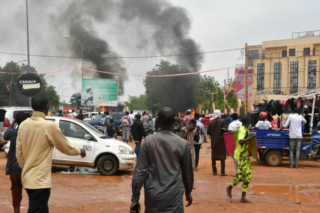 A general view of billowing smoke as supporters of Niger’s defense and security forces attack the headquarters of the Nigerien Party for Democracy and Socialism, the party of overthrown President Mohamed Bazoum, in Niamey, Thursday. A general view of billowing smoke as supporters of Niger's defense and security forces attack the headquarters of the Nigerien Party for Democracy and Socialism, the party of overthrown President Mohamed Bazoum, in Niamey, Thursday.
