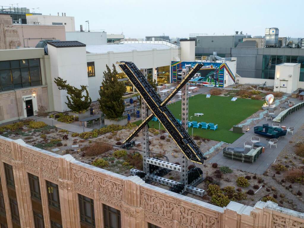 An aerial view shows a newly constructed “X” sign on the roof of the headquarters of the social media platform previously known as Twitter, in San Francisco, on July 29. An aerial view shows a newly constructed