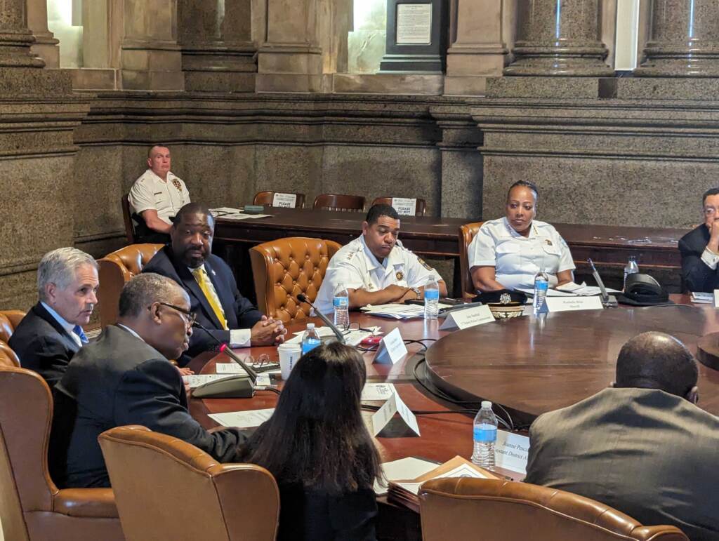 gun-violence-meeting-city-hall-s-searles-2023-07-13-1 City Leaders sitting at a round table during a meeting.