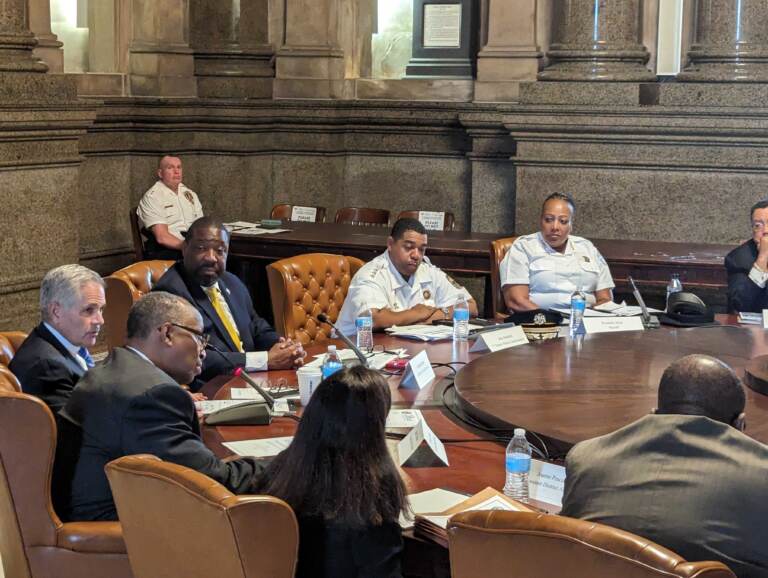 City Leaders sitting at a round table during a meeting.