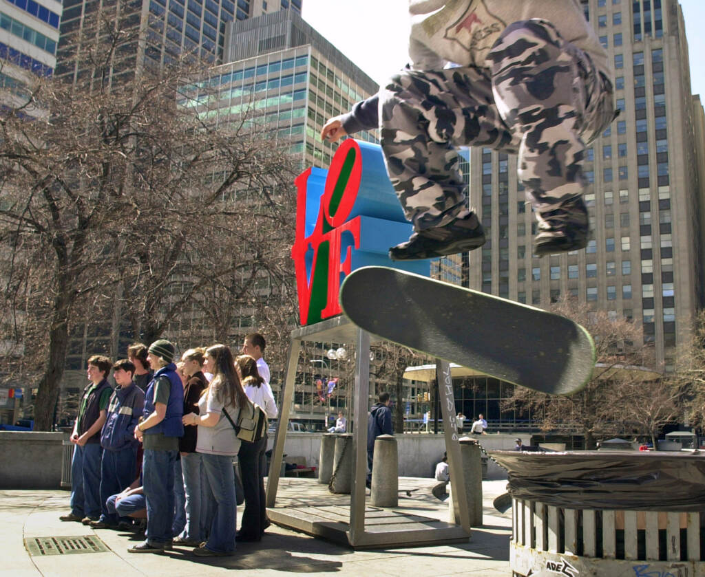 COLE Skateborarder in mid-air at Love Park.