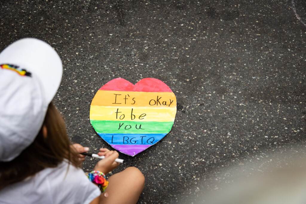 Children make Pride art at the 