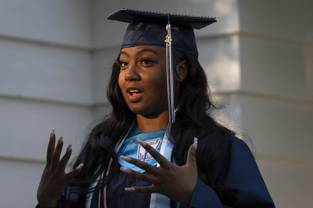 School Equity Pennsylvania Nylla Miller speaks in a close-up photo. She is wearing her high school graduation cap and gown.